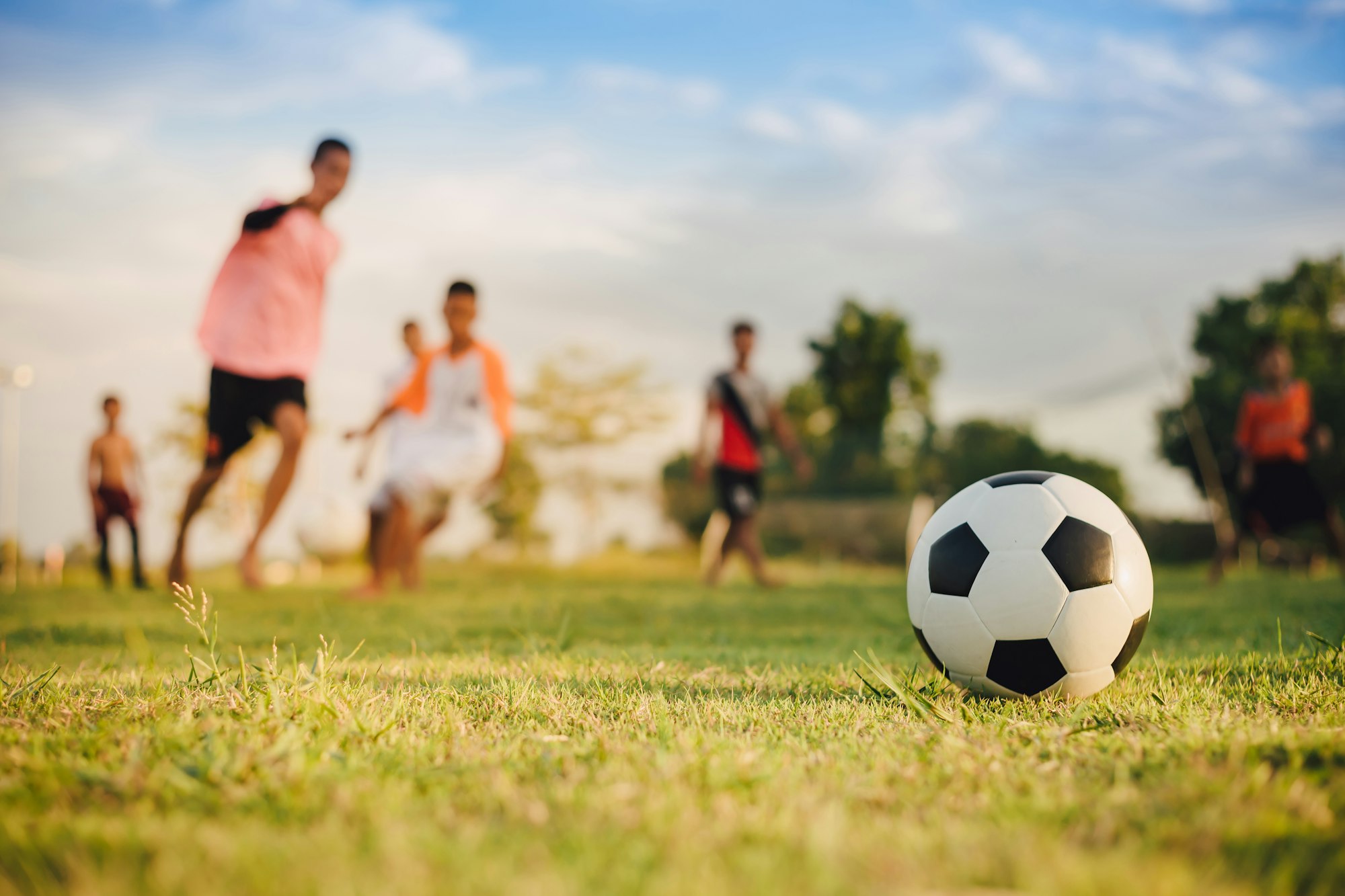 Children playing soccer football
